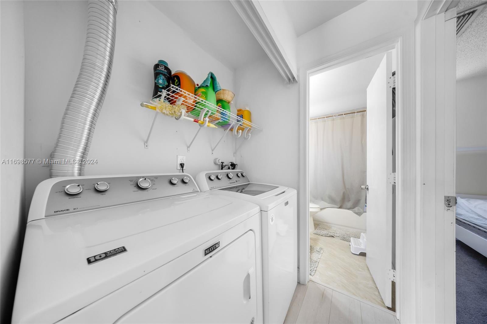 4440 Northeast 5th Avenue Boca Raton, FL 33431 - Photo 30 of 50 a utility room with dryer and washer