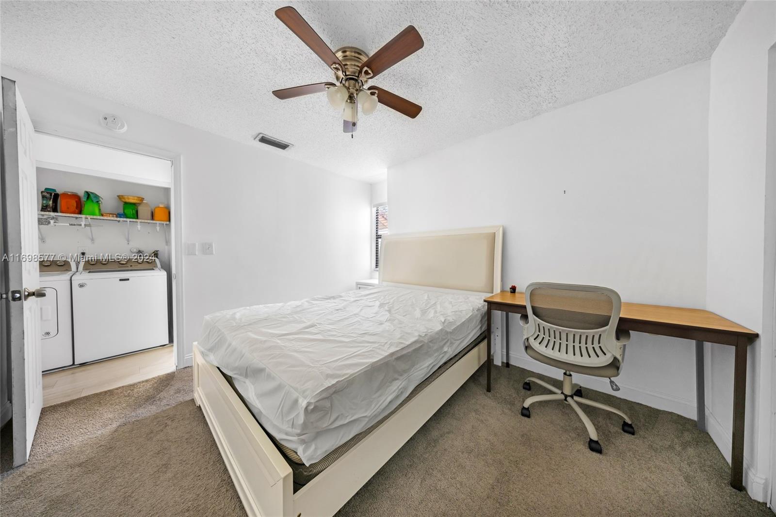4440 Northeast 5th Avenue Boca Raton, FL 33431 - Photo 33 of 50 a bedroom with a bed and a chair in it