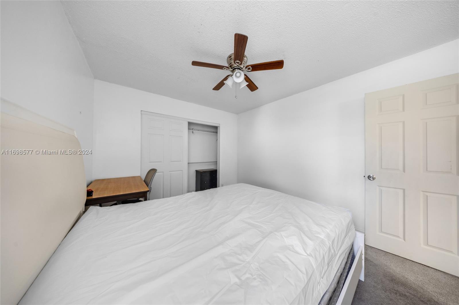 4440 Northeast 5th Avenue Boca Raton, FL 33431 - Photo 34 of 50 a bedroom with a bed and ceiling fan