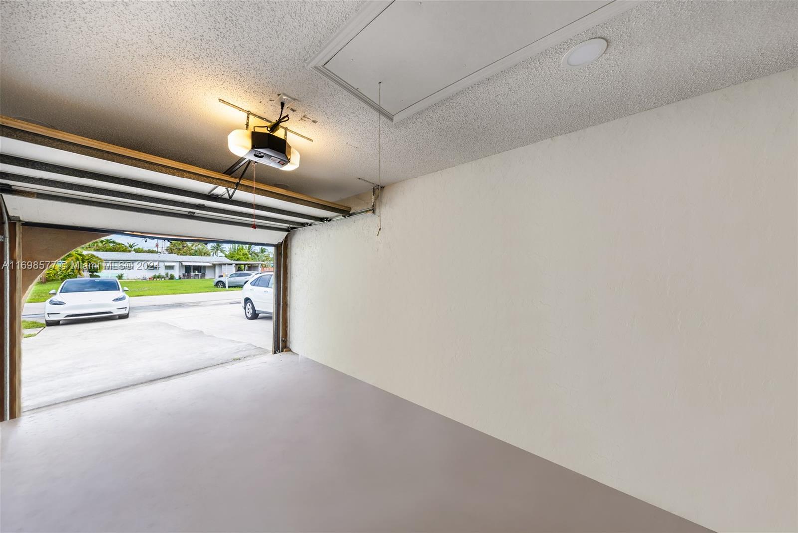 4440 Northeast 5th Avenue Boca Raton, FL 33431 - Photo 35 of 50 a view of room with a large window and chandelier