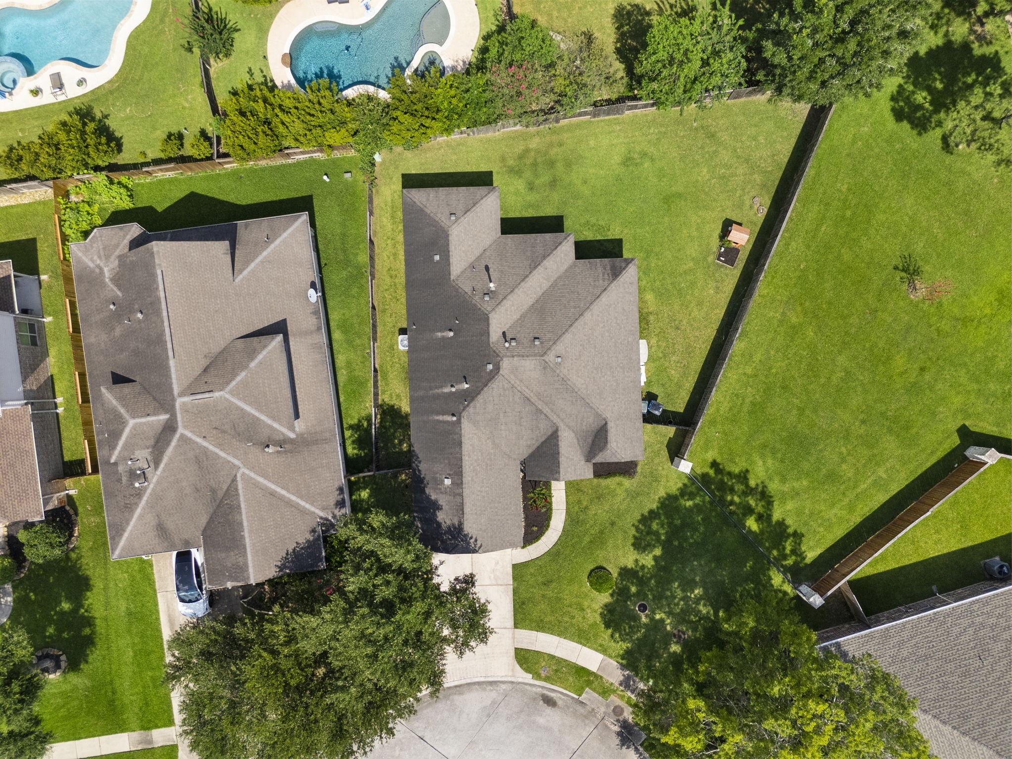 174 Maple Grove Drive Conroe, TX 77384 - Photo 23 of 26 An aerial view showcasing the generous pie-shaped lot and the ample outdoor space this home has to offer.