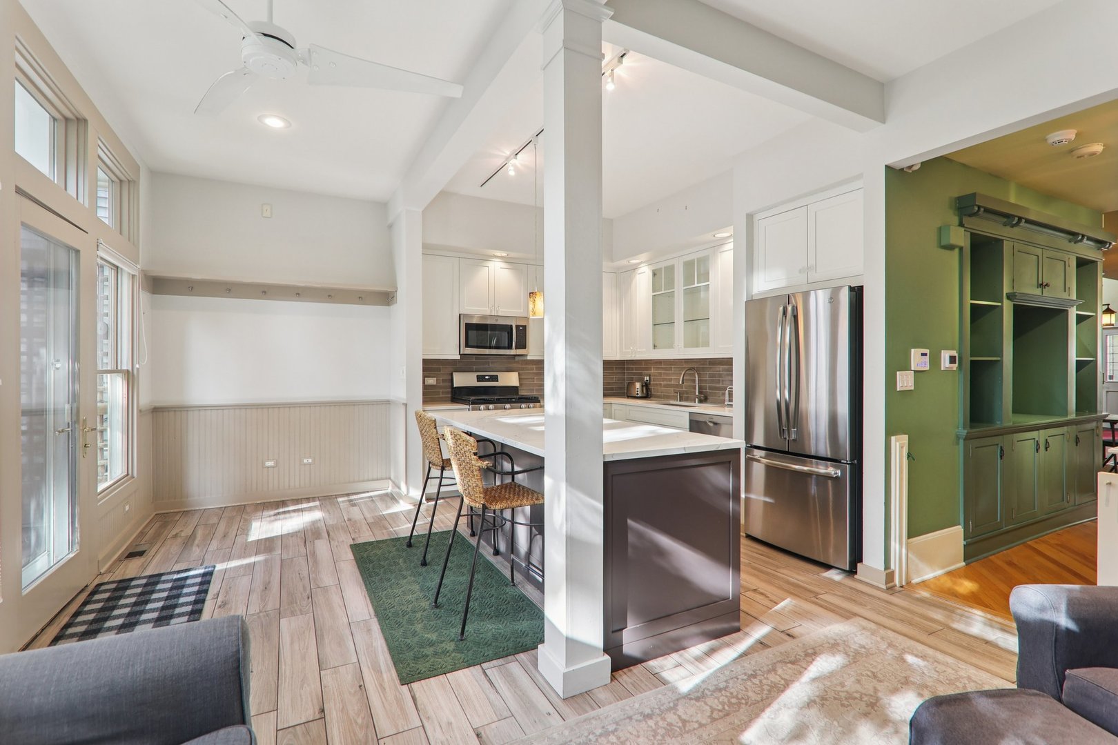 1027 West Newport Avenue Chicago, IL 60657 - Photo 12 of 36 a kitchen with granite countertop a refrigerator and a sink