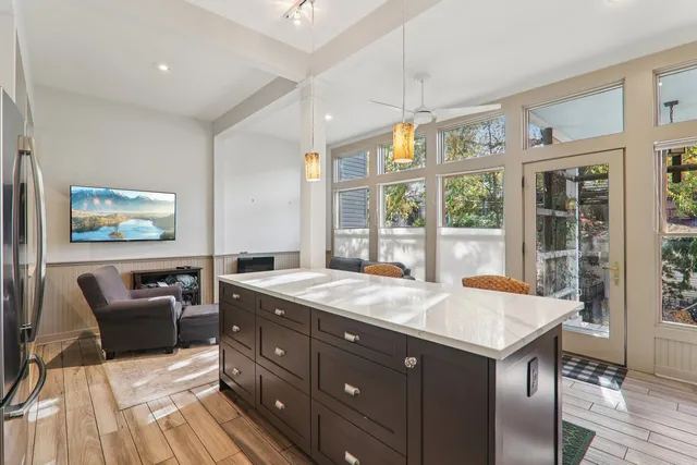 a kitchen with a sink stove and refrigerator