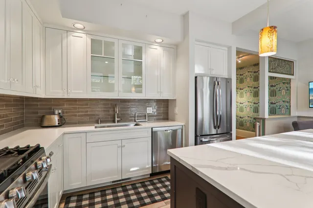 a view of a kitchen with utility area