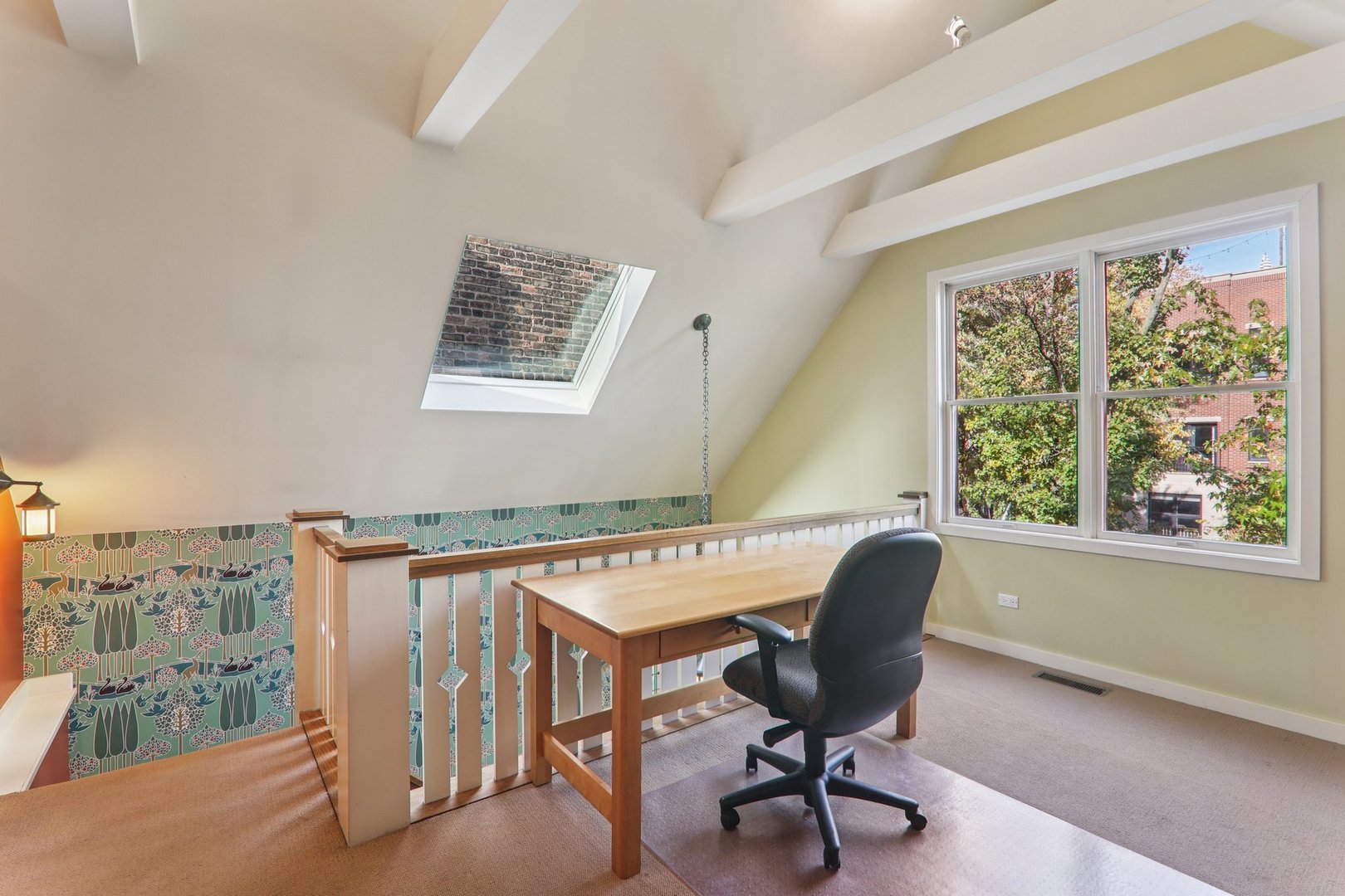 1027 West Newport Avenue Chicago, IL 60657 - Photo 19 of 36 a view of a workspace with furniture and a window