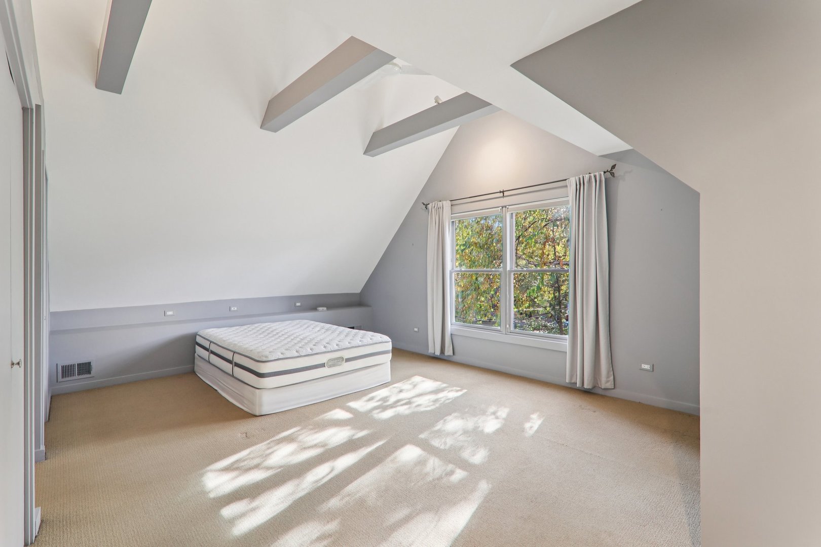 1027 West Newport Avenue Chicago, IL 60657 - Photo 22 of 36 a view of room with stairs and chandelier fan