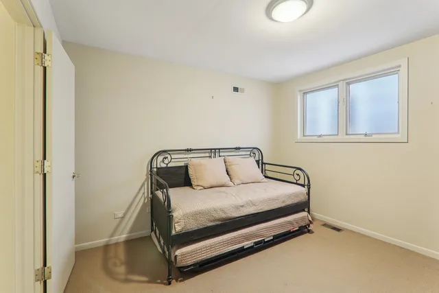 front view of a house with a tree