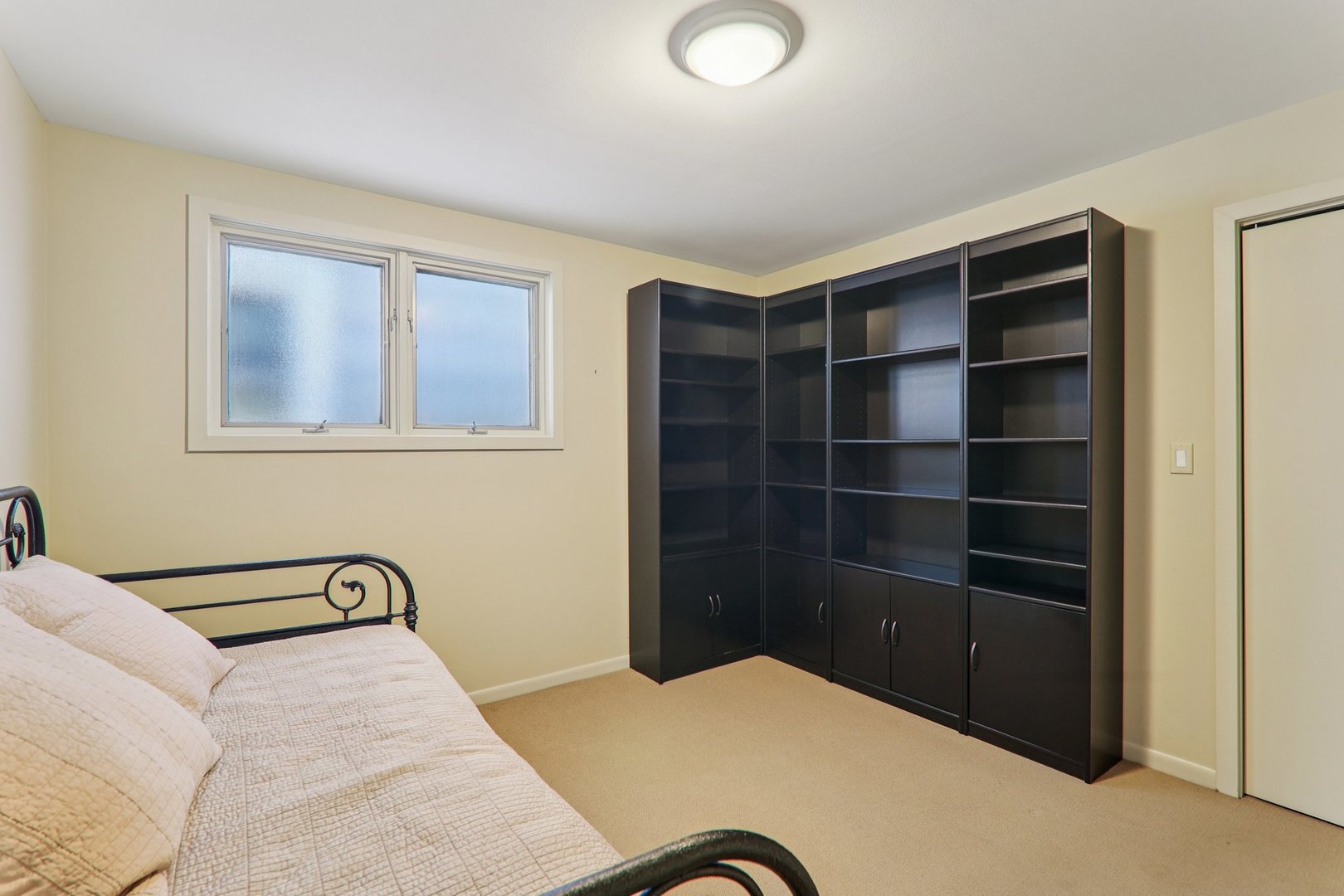 1027 West Newport Avenue Chicago, IL 60657 - Photo 28 of 36 a bedroom with a bed and a window