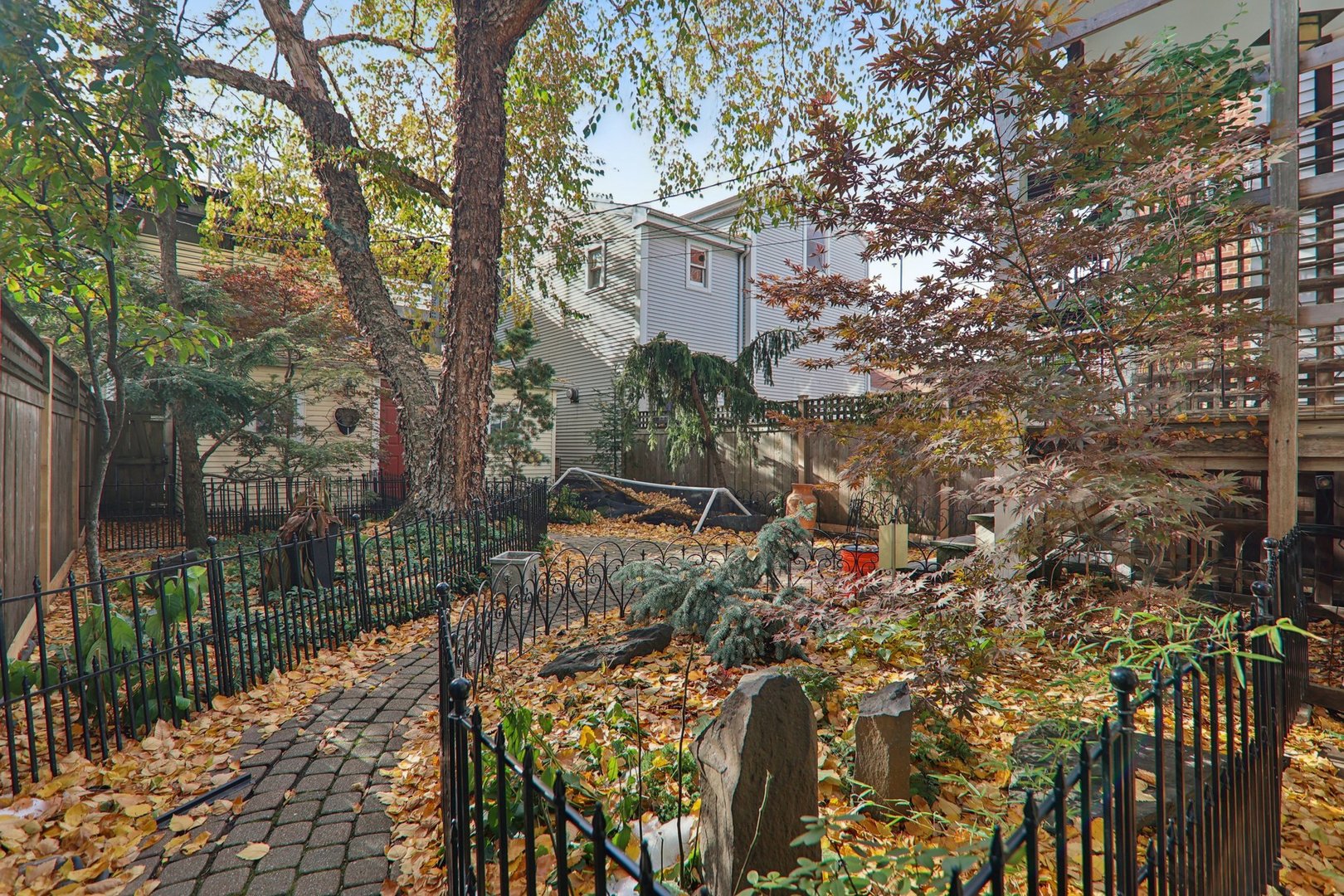 1027 West Newport Avenue Chicago, IL 60657 - Photo 31 of 36 a view of a house with a tree in front of it