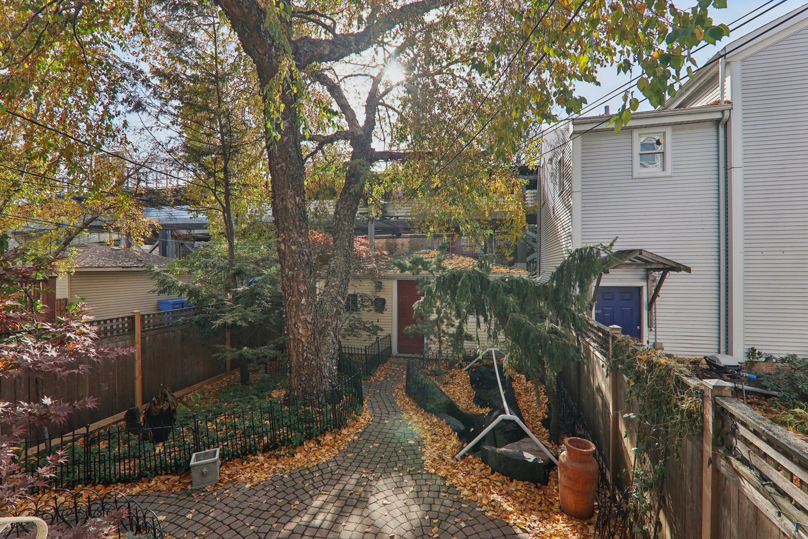 1027 West Newport Avenue Chicago, IL 60657 - Photo 32 of 36 a view of a house with backyard and trees