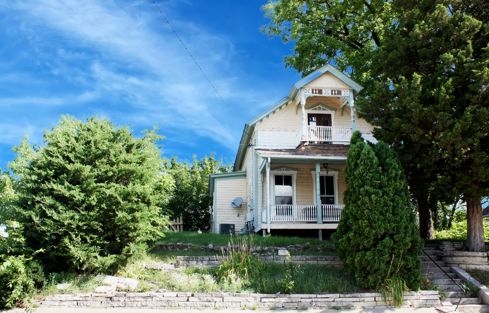 472 Division Street Elgin, IL 60120 - Photo 1 of 20 a front view of a house with a yard