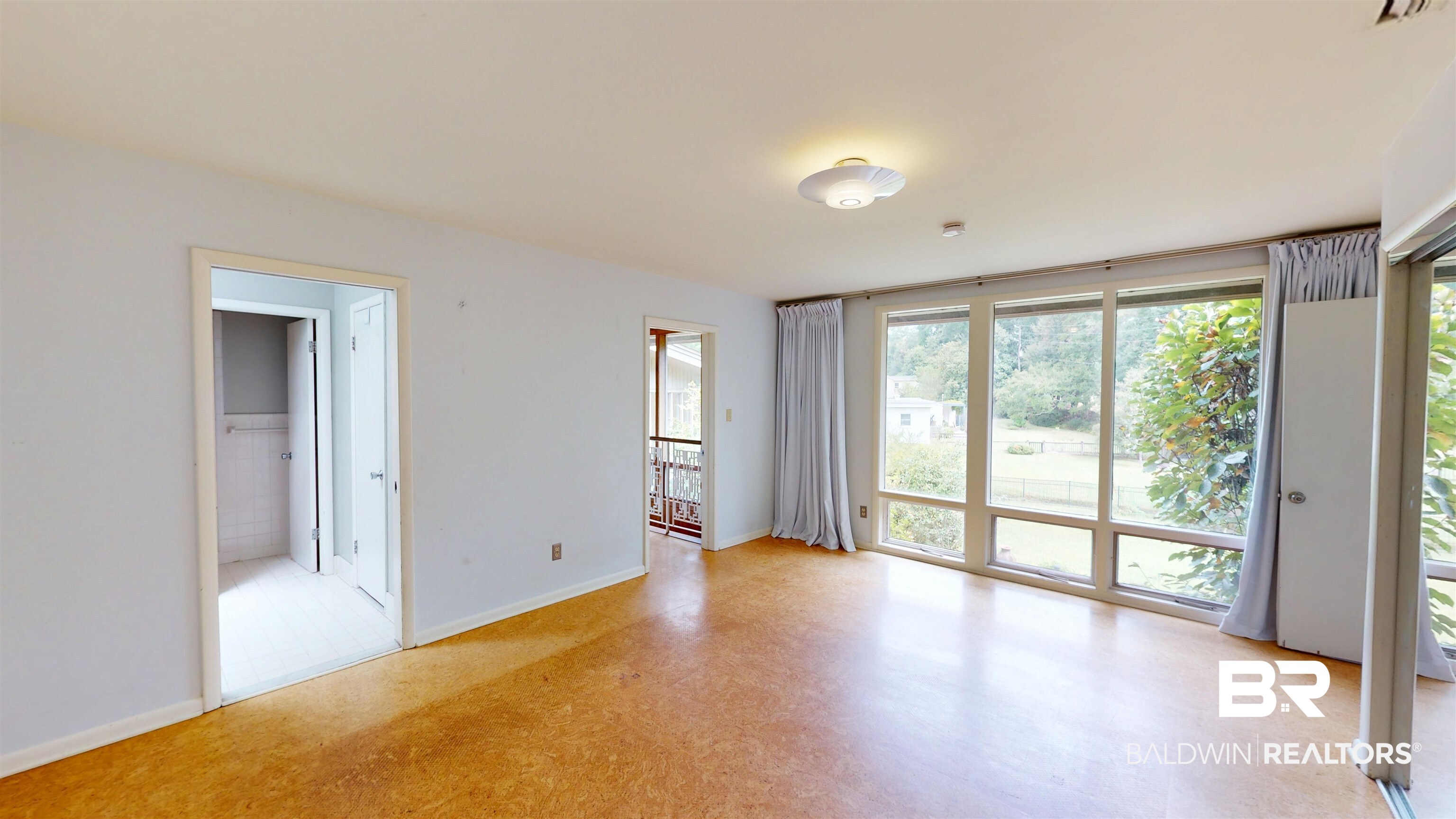 15 Spring Bank Road Mobile, AL 36608 - Photo 47 of 58 Unfurnished bedroom featuring baseboards and access to outside