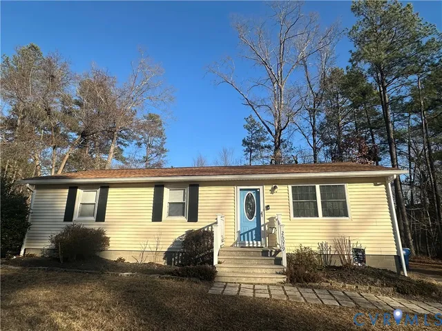 a view of a swimming pool with a yard