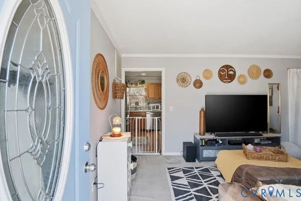 a living room with furniture and a flat screen tv