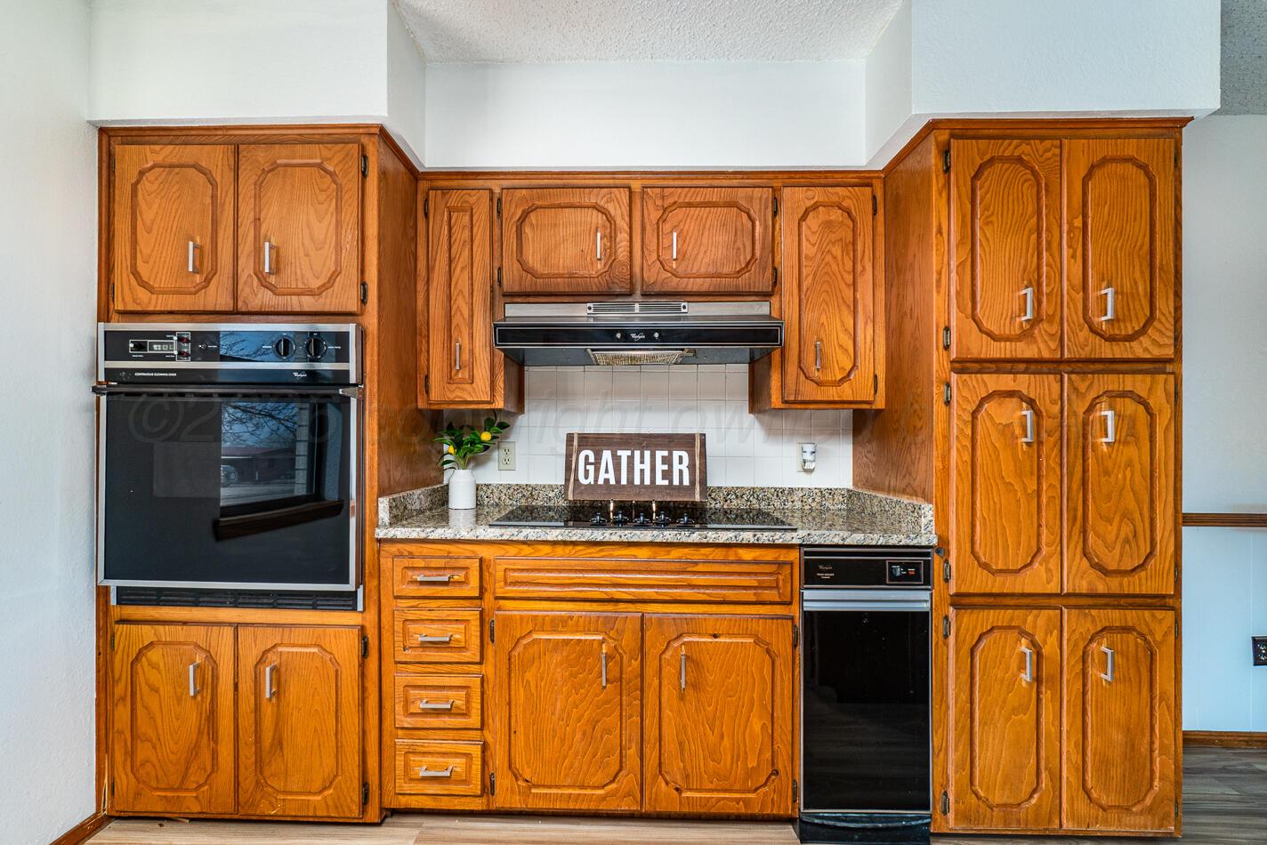 607 Mississippi Street Borger, TX 79007 - Photo 3 of 23 a kitchen with stainless steel appliances granite countertop a stove top oven