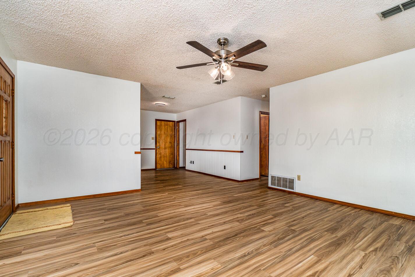 607 Mississippi Street Borger, TX 79007 - Photo 8 of 23 a view of empty room with wooden floor
