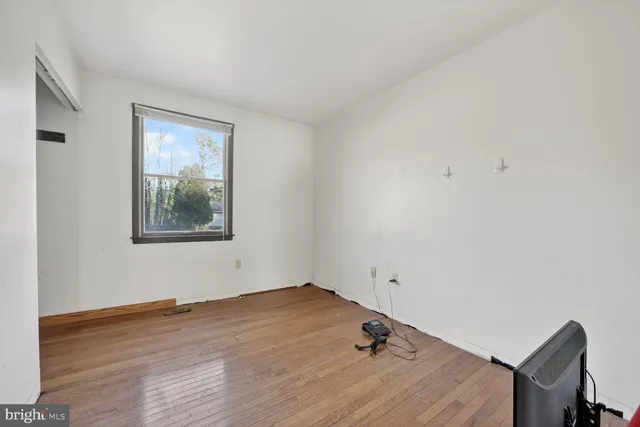 a bathroom with a sink toilet and mirror