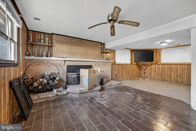 a view of a livingroom with furniture and a flat screen tv