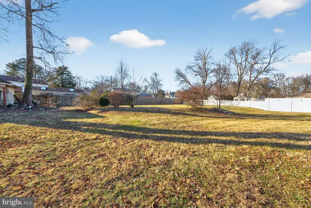 a view of yard and swimming pool
