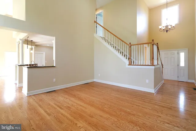 a bathroom with a toilet a sink and a mirror