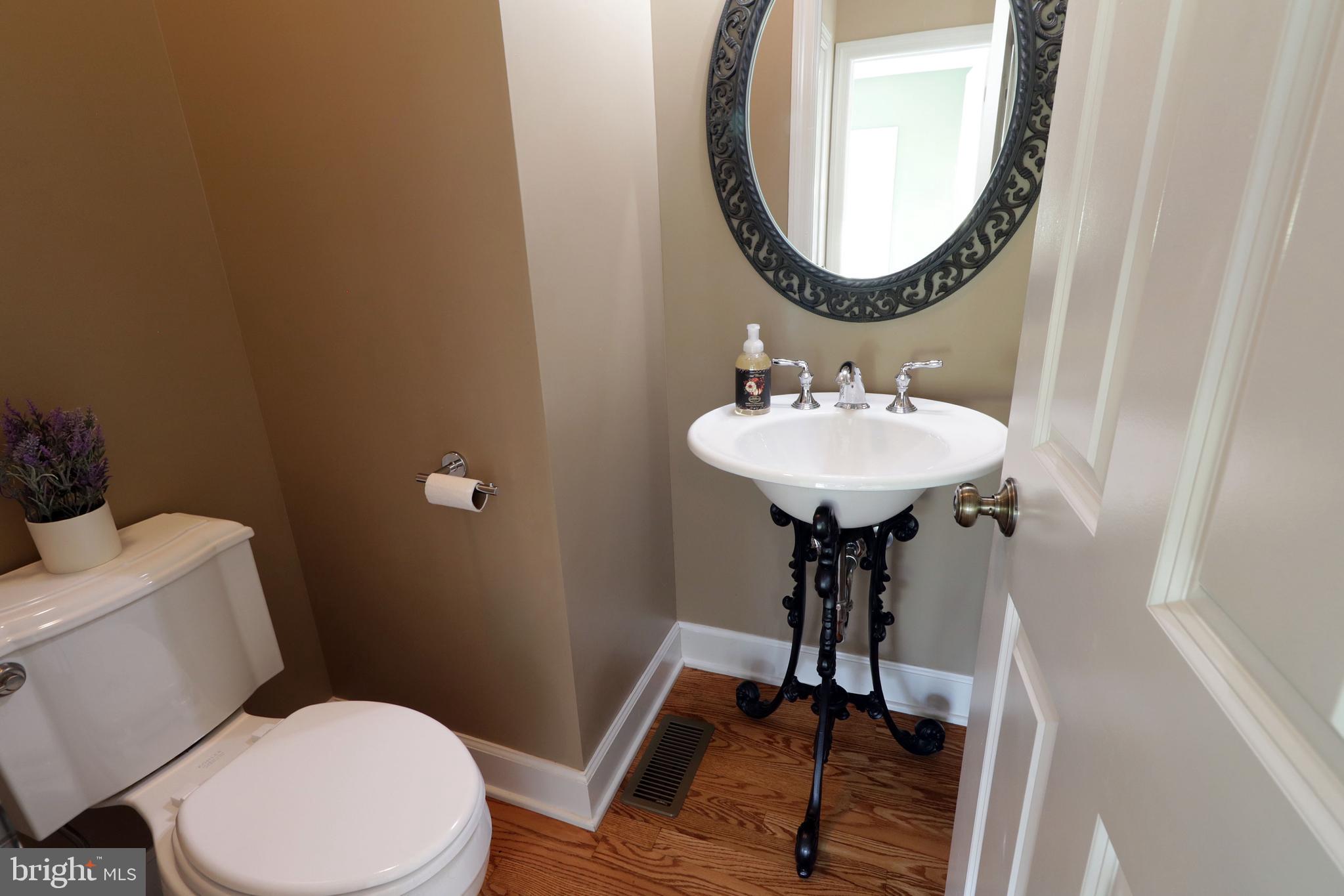 135 Fernleaf Court State College, PA 16801 - Photo 25 of 53 a bathroom with a toilet a sink and a mirror