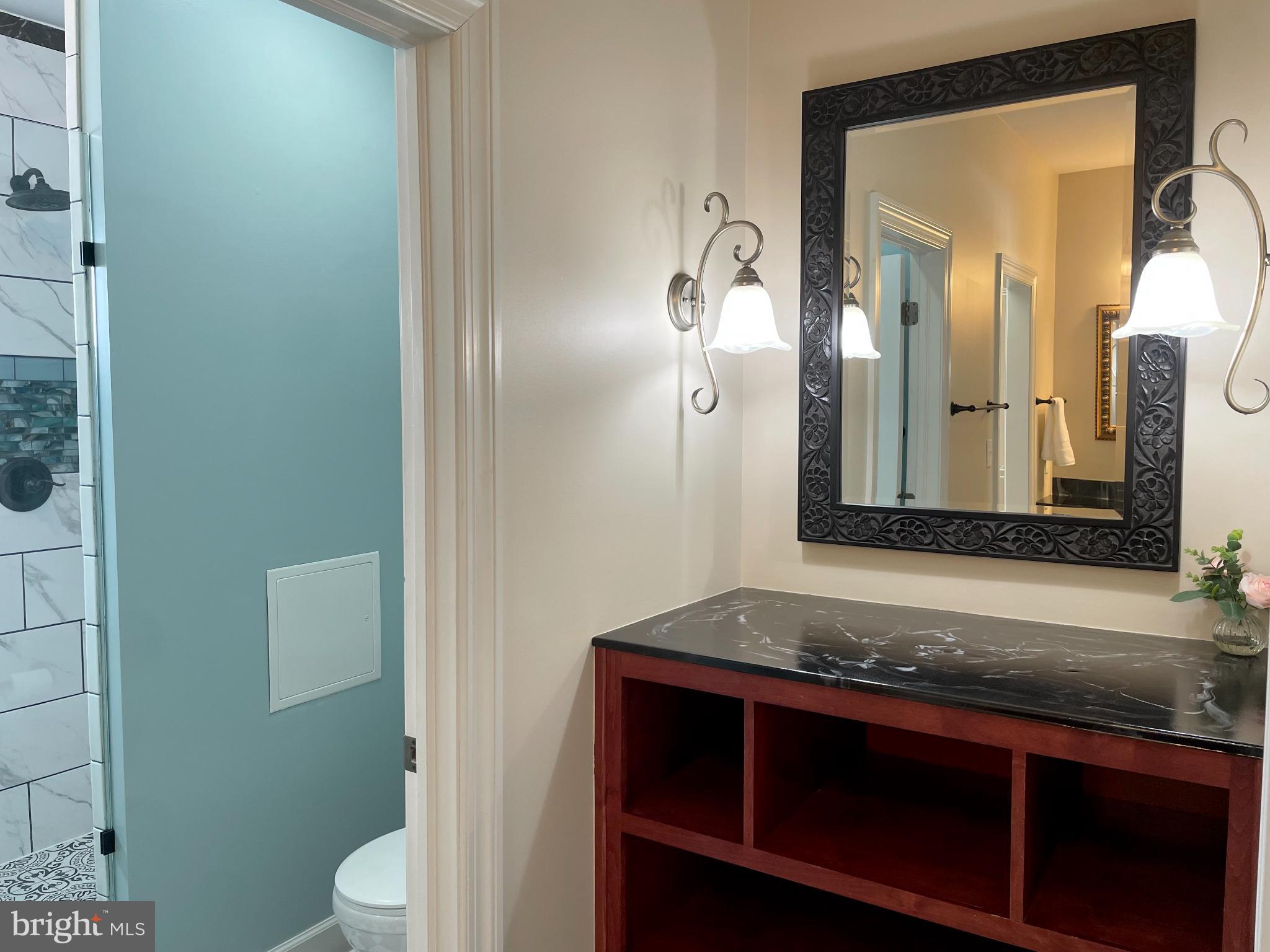 135 Fernleaf Court State College, PA 16801 - Photo 31 of 53 a bathroom with a granite countertop sink and a mirror