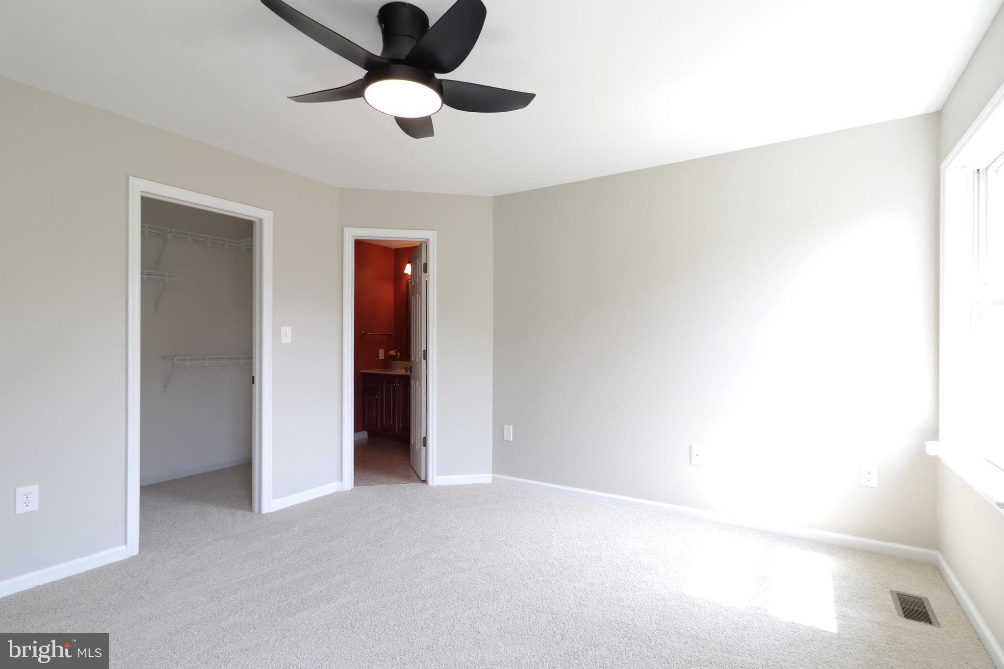 135 Fernleaf Court State College, PA 16801 - Photo 35 of 53 a view of an empty room with a ceiling fan