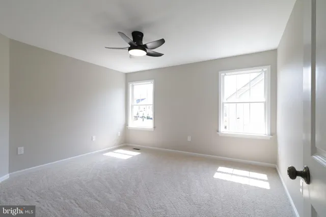 a bathroom with a double vanity sink and mirror