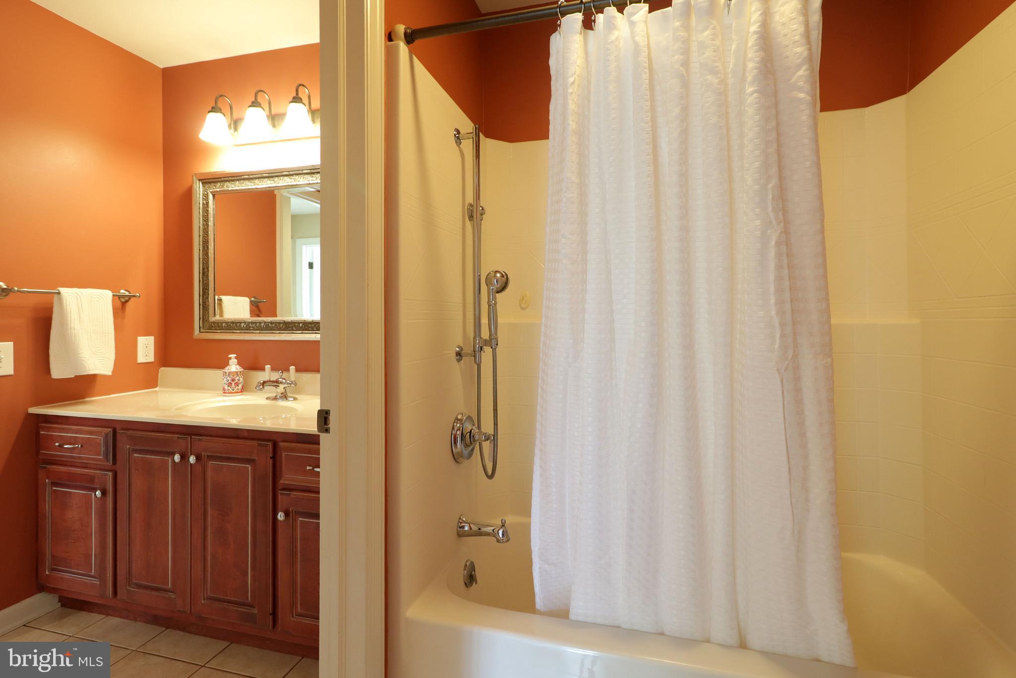 135 Fernleaf Court State College, PA 16801 - Photo 38 of 53 a bathroom with a granite countertop sink and a mirror