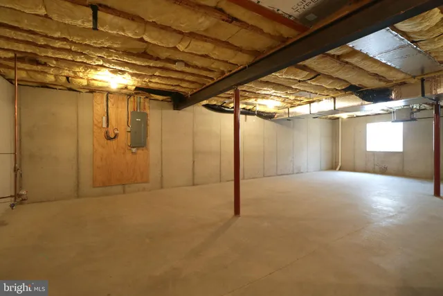 a view of a house with table and chairs in patio