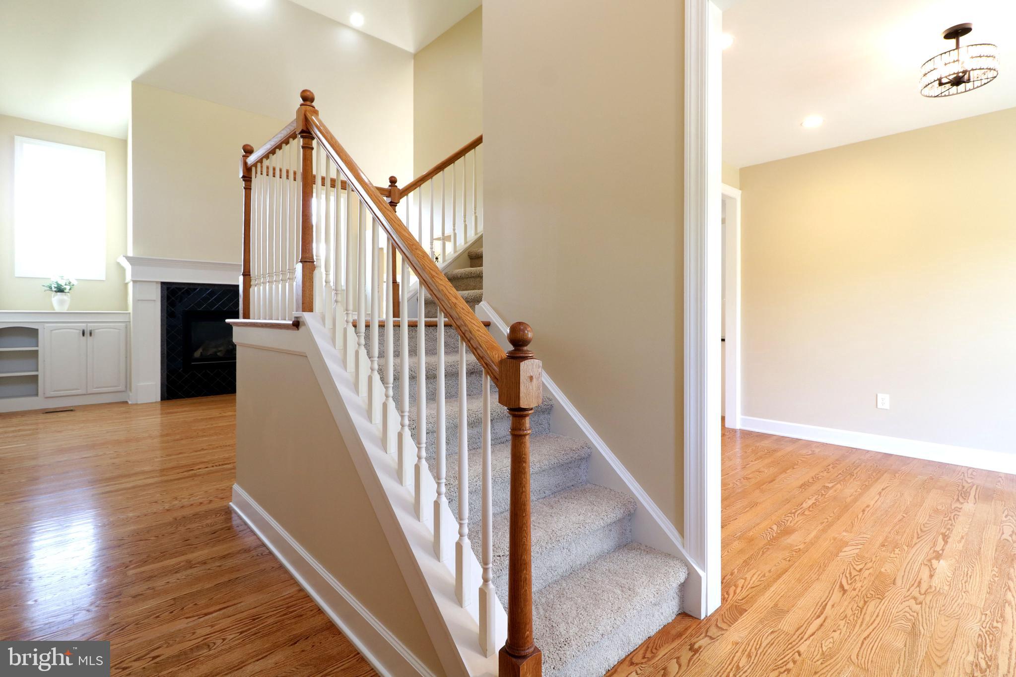 135 Fernleaf Court State College, PA 16801 - Photo 6 of 53 a view of entryway and hall with wooden floor