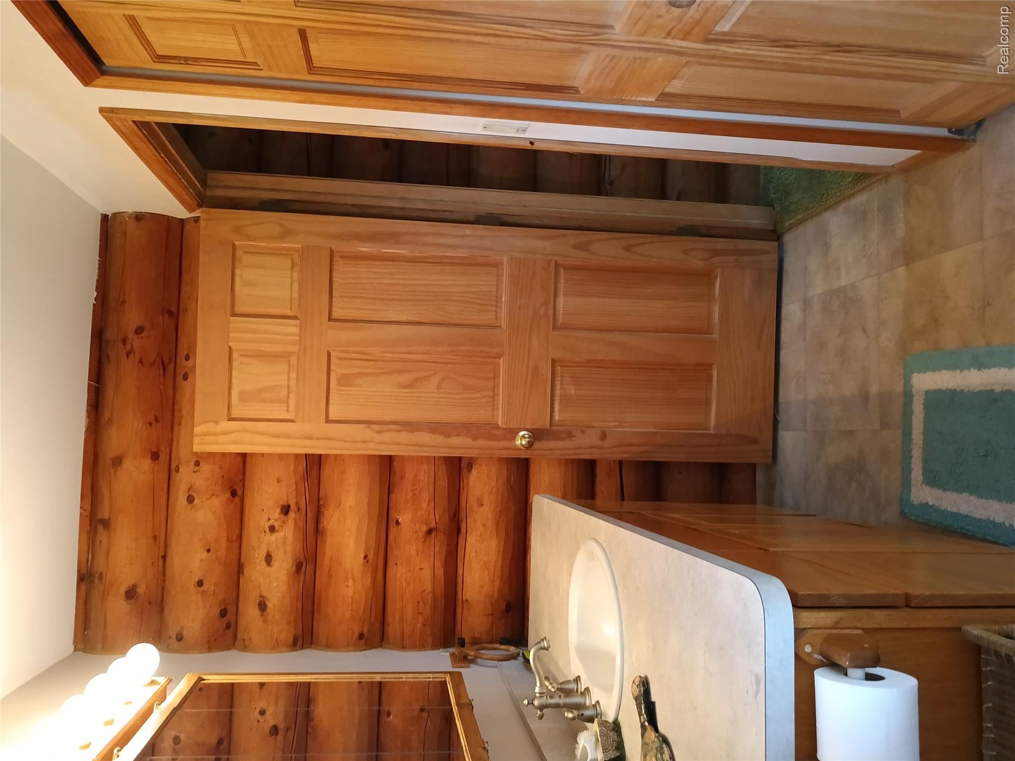 10374 Wilson Road Otisville, MI 48463 - Photo 58 of 99 Bathroom featuring vanity and rustic walls