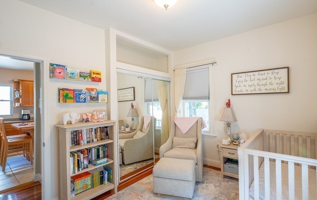 12 Thelma Road, Unit 3 Boston, MA 02122 - Photo 11 of 18 a living room with furniture and a book shelf