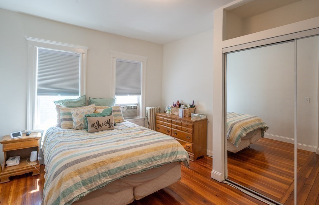 12 Thelma Road, Unit 3 Boston, MA 02122 - Photo 13 of 18 a bedroom with a bed and a window