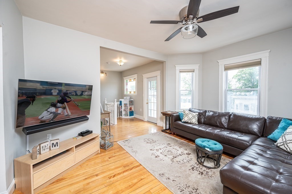 12 Thelma Road, Unit 3 Boston, MA 02122 - Photo 2 of 18 a living room with furniture and a flat screen tv