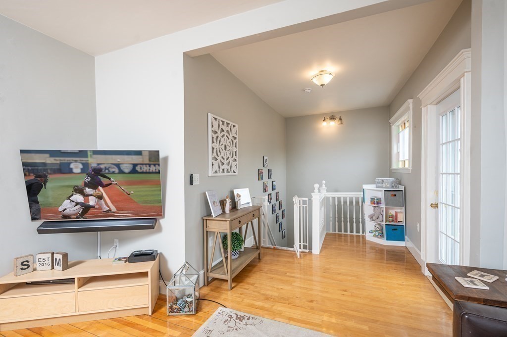 12 Thelma Road, Unit 3 Boston, MA 02122 - Photo 3 of 18 a room with lots of wooden floor