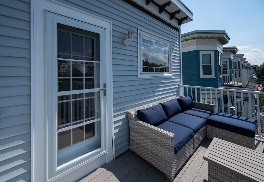 12 Thelma Road, Unit 3 Boston, MA 02122 - Photo 4 of 18 a view of a house with couches in front of house