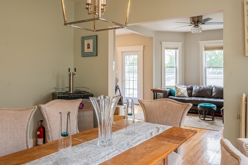 12 Thelma Road, Unit 3 Boston, MA 02122 - Photo 5 of 18 a living room with furniture and a chandelier