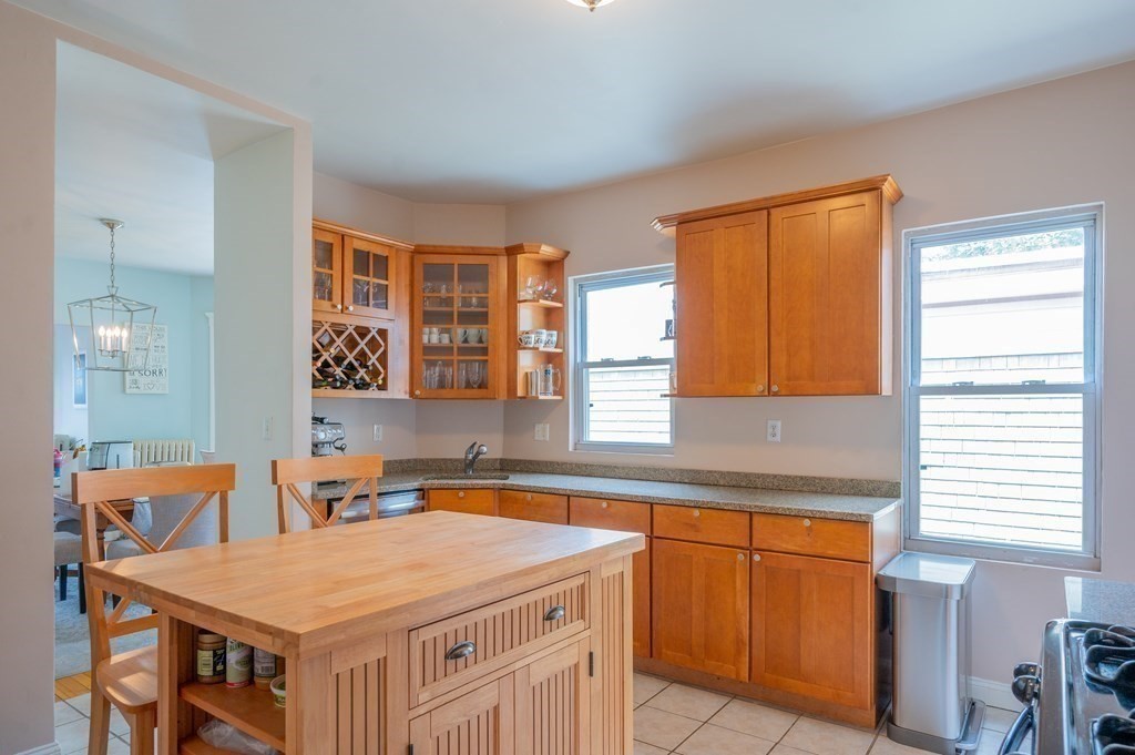 12 Thelma Road, Unit 3 Boston, MA 02122 - Photo 8 of 18 a kitchen that has a sink and a table in it