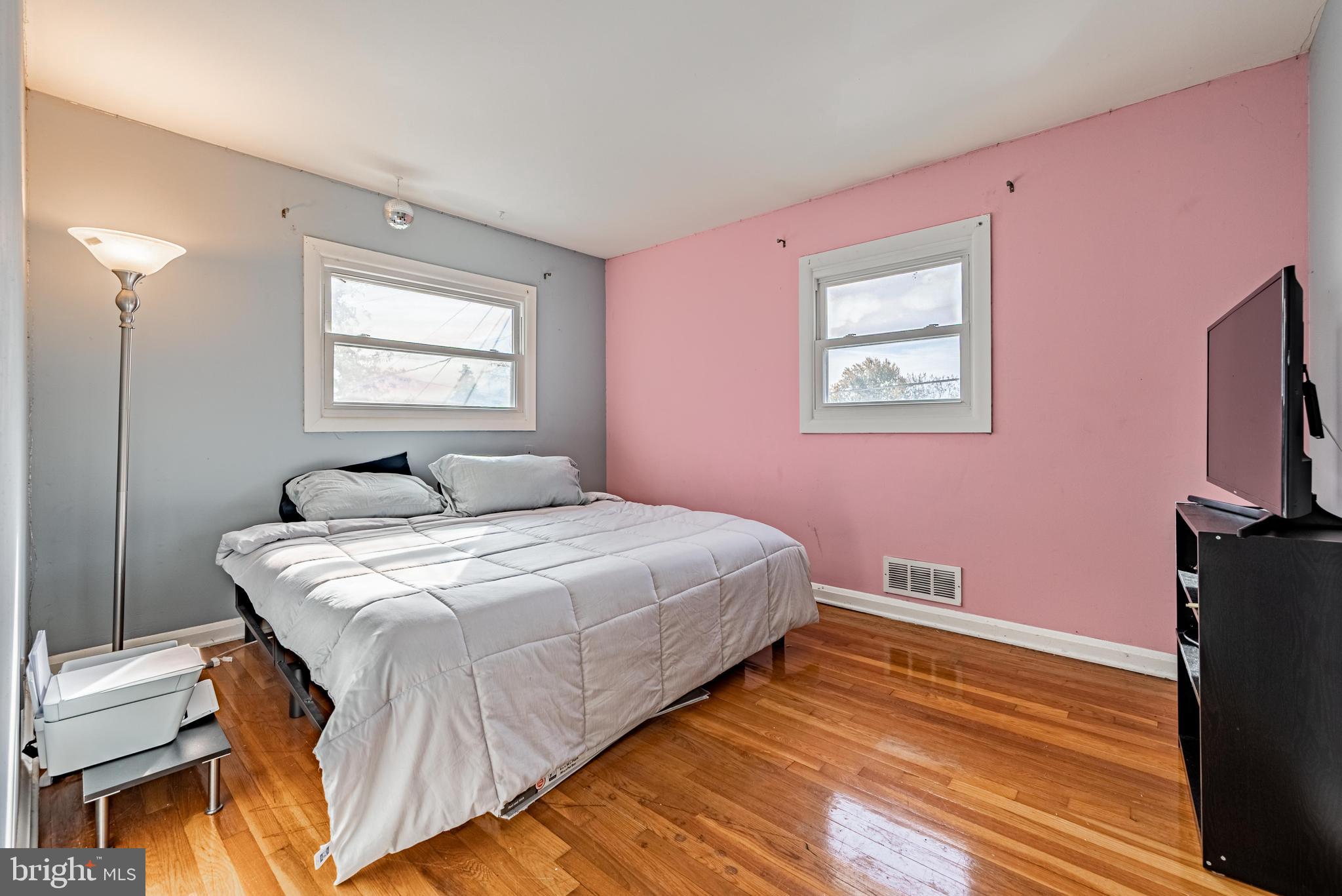 3621 Washington Avenue Baltimore, MD 21244 - Photo 17 of 25 a bedroom with a bed and a flat screen tv