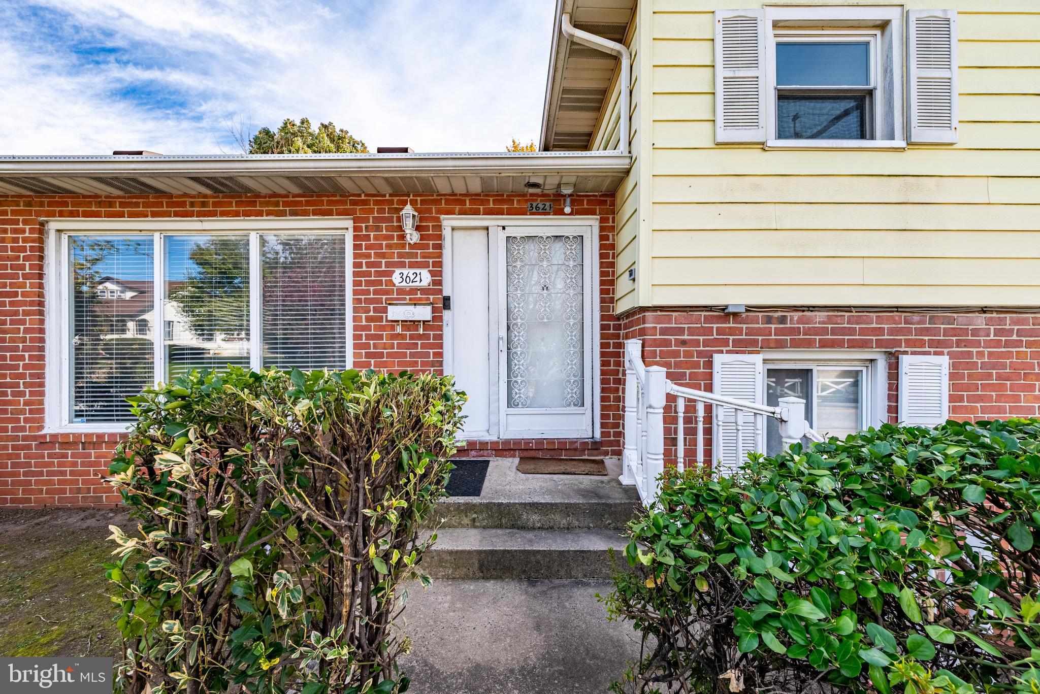 3621 Washington Avenue Baltimore, MD 21244 - Photo 3 of 25 front view of house with potted plants