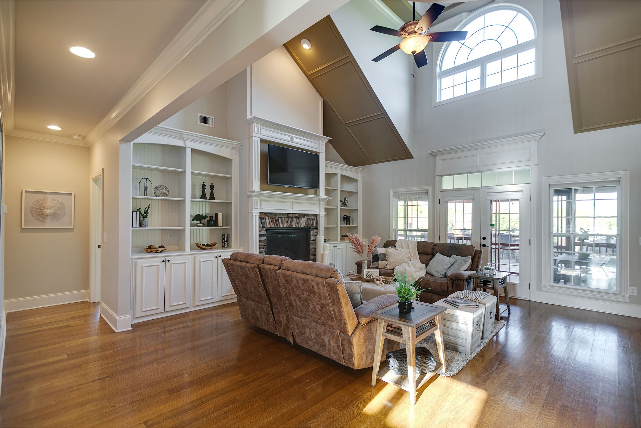 2104 Berry Patch Road Thompson's Station, TN 37064 - Photo 14 of 50 a living room with fireplace furniture and a wooden floor