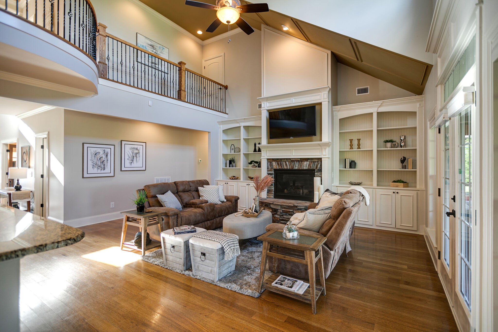 2104 Berry Patch Road Thompson's Station, TN 37064 - Photo 15 of 50 a living room with furniture a fireplace and a flat screen tv