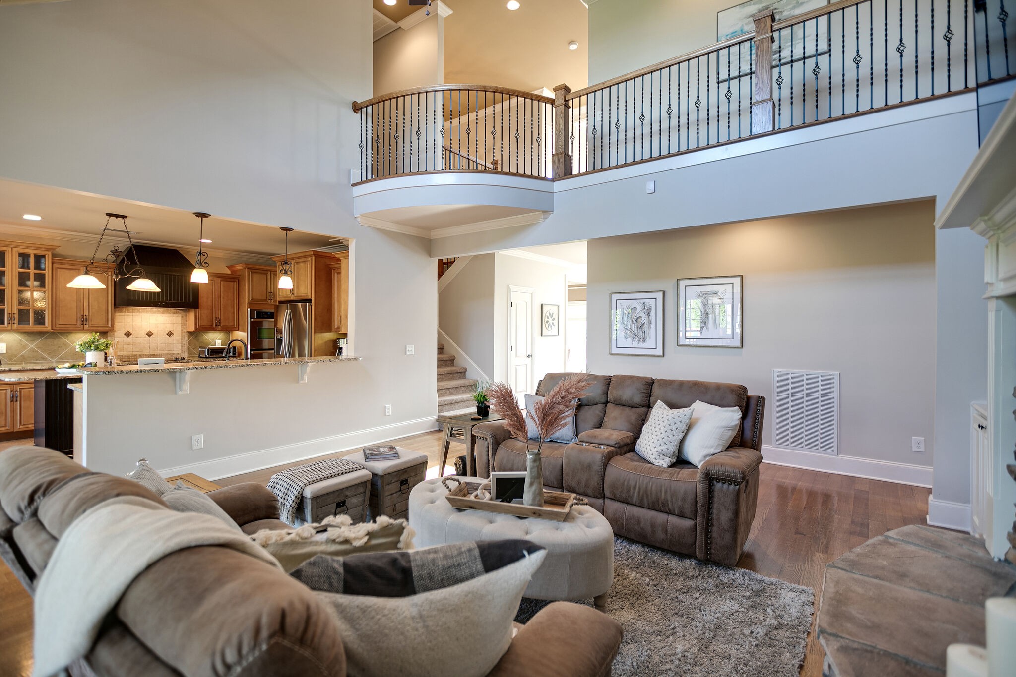 2104 Berry Patch Road Thompson's Station, TN 37064 - Photo 17 of 50 a living room with furniture and a kitchen view