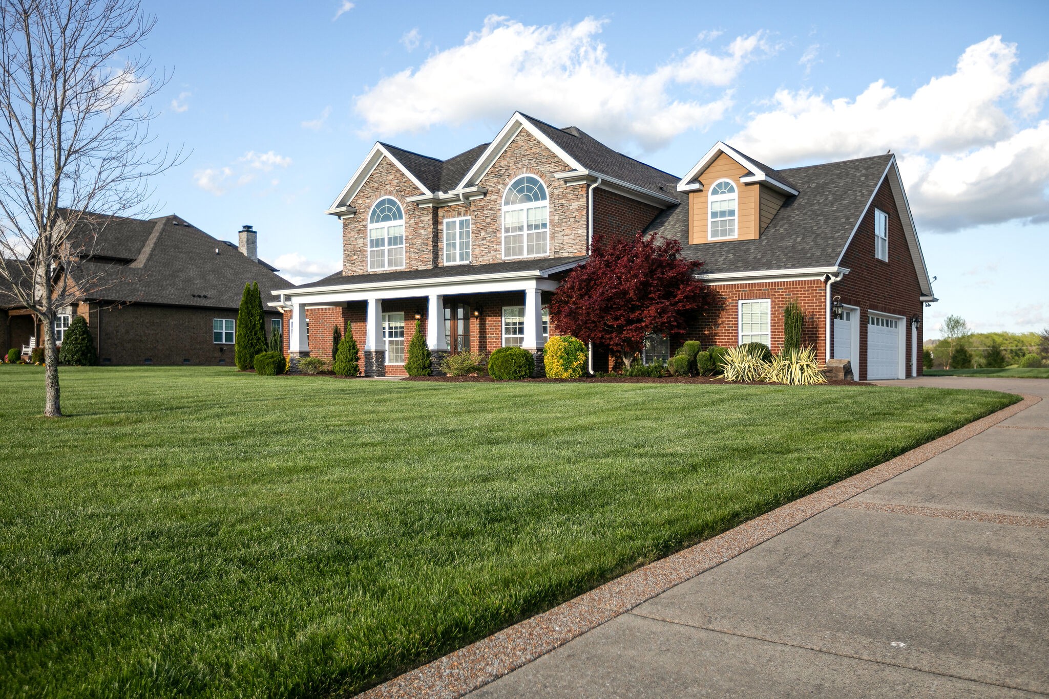 2104 Berry Patch Road Thompson's Station, TN 37064 - Photo 3 of 50 a front view of a house with a garden