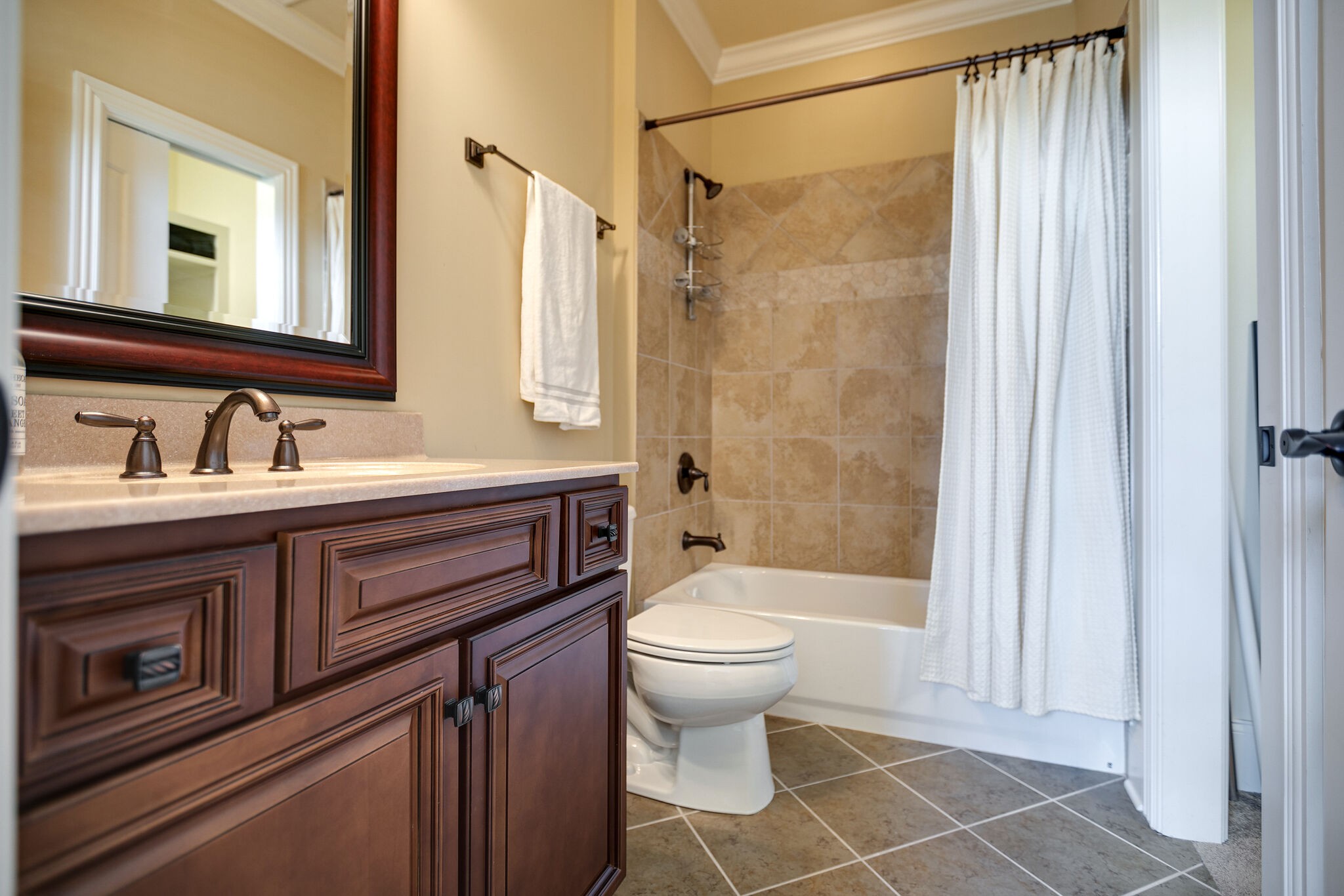 2104 Berry Patch Road Thompson's Station, TN 37064 - Photo 37 of 50 a bathroom with a sink a toilet a mirror and shower