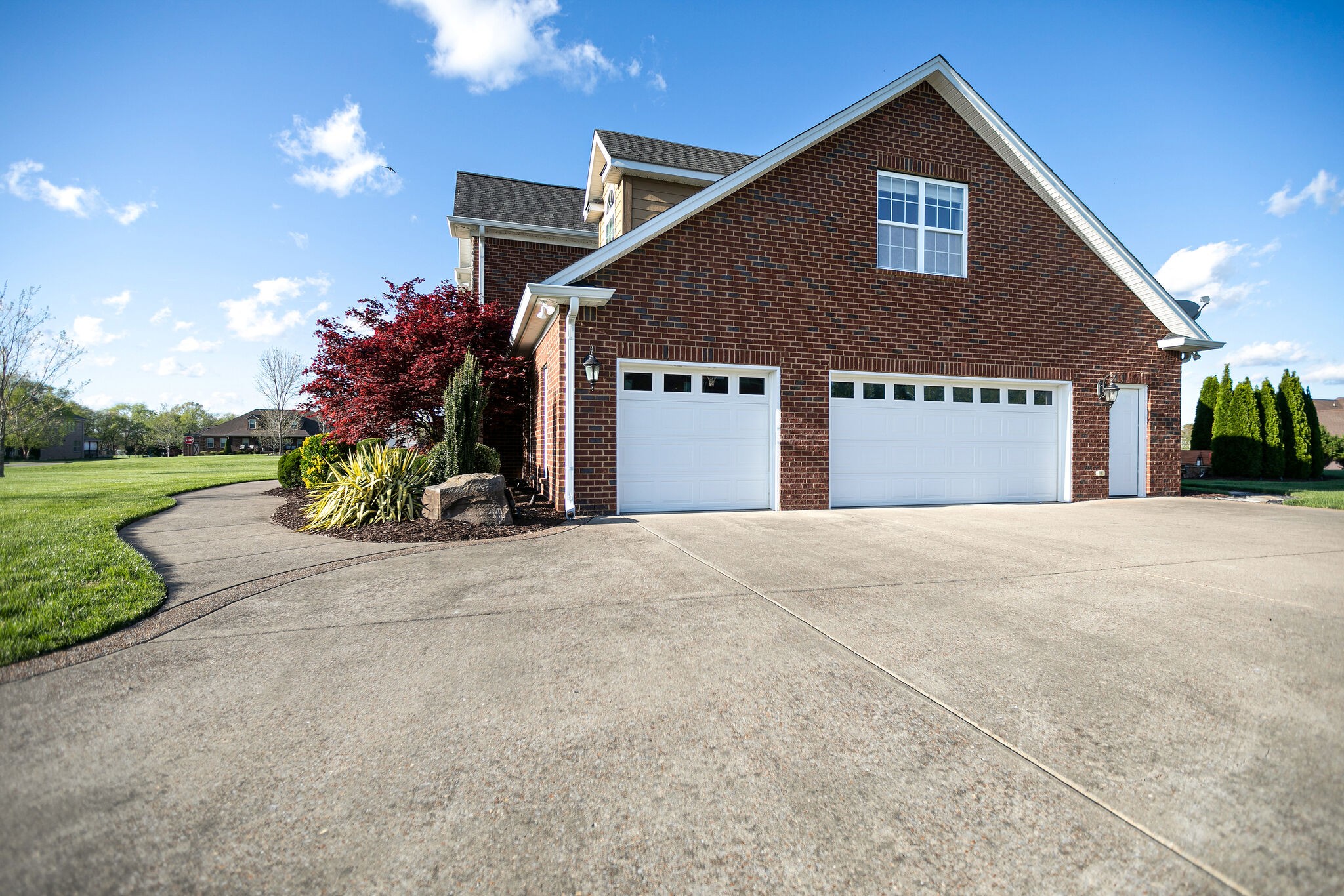 2104 Berry Patch Road Thompson's Station, TN 37064 - Photo 4 of 50 a front view of a house with a yard and garage
