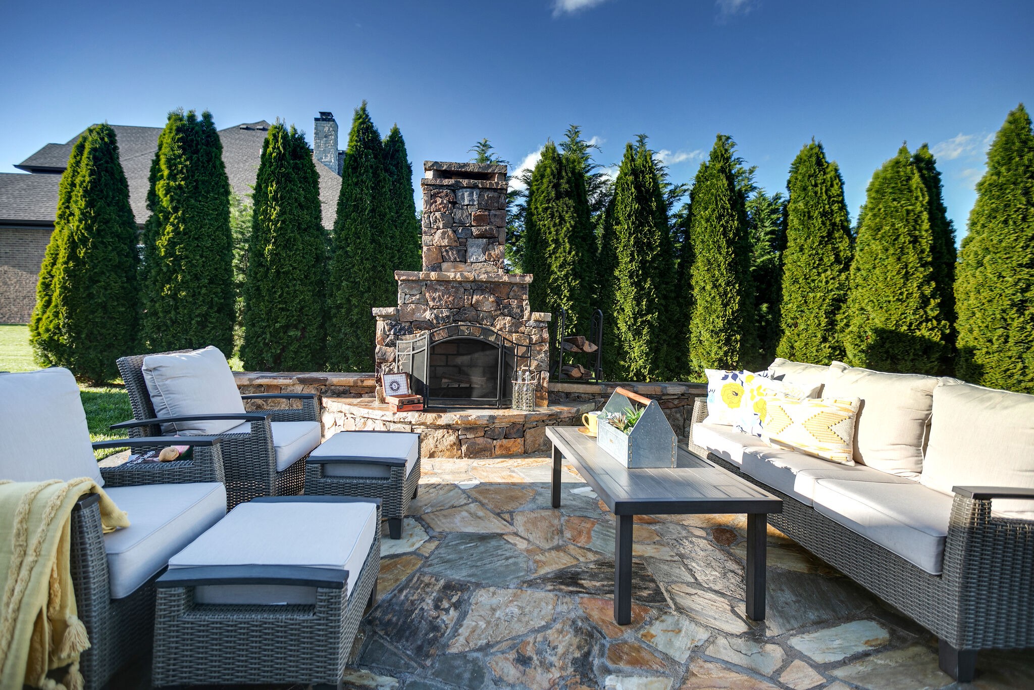2104 Berry Patch Road Thompson's Station, TN 37064 - Photo 46 of 50 a view of a patio with couches table and chairs with plants and trees