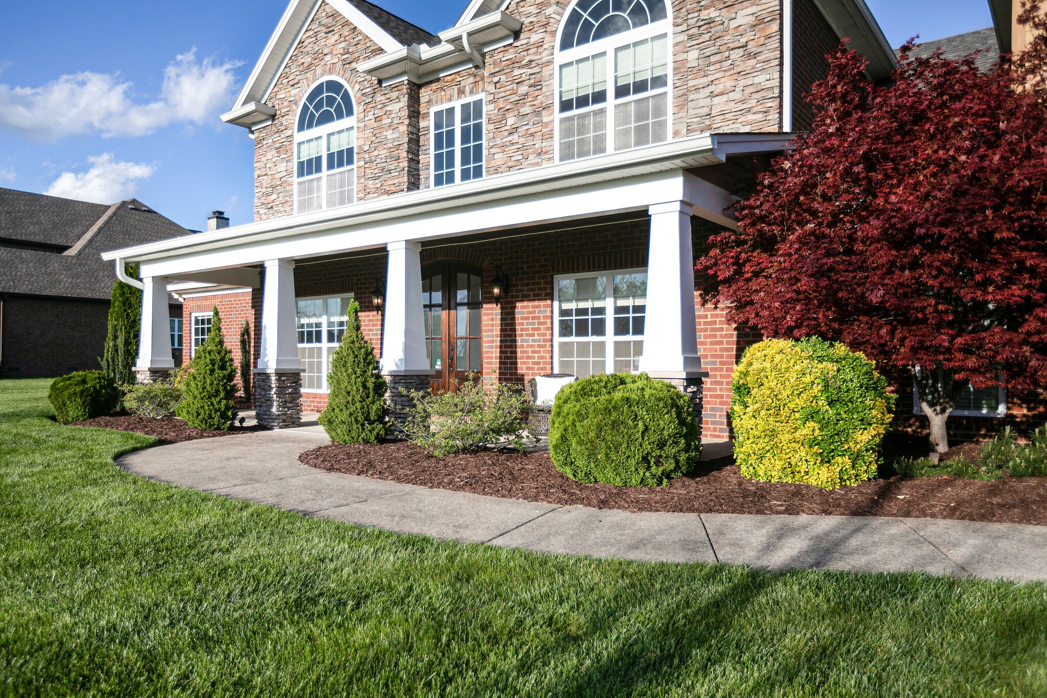 2104 Berry Patch Road Thompson's Station, TN 37064 - Photo 5 of 50 front view of a house with a yard