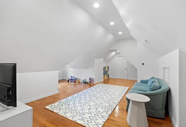 a living room with a rug and a table